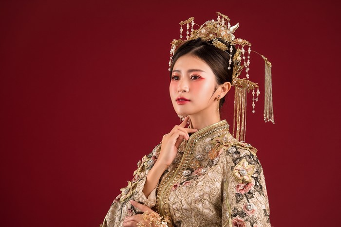Asian woman in traditional dress and jewelry