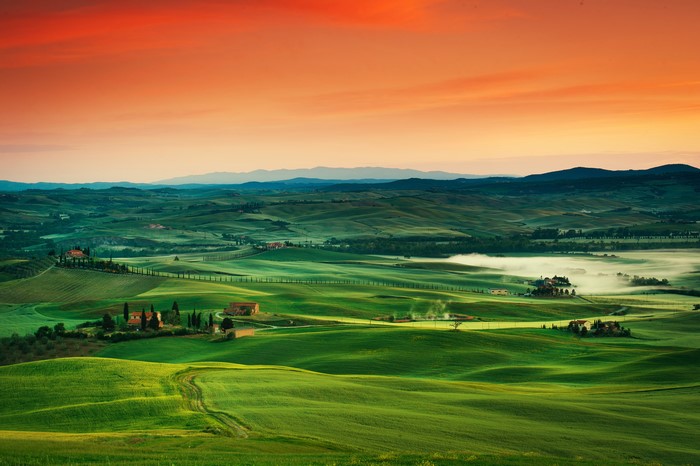 Tuscany landscape with rolling hills and sunrise