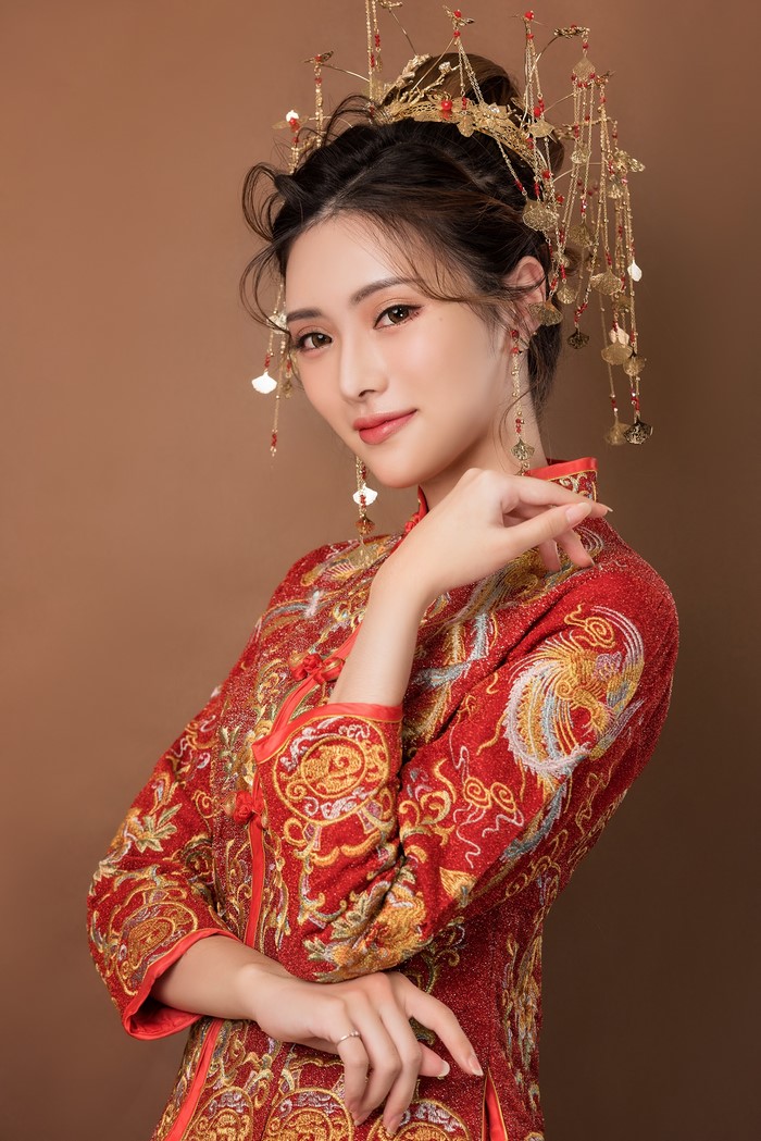 Woman in traditional red Chinese dress with elaborate headdress