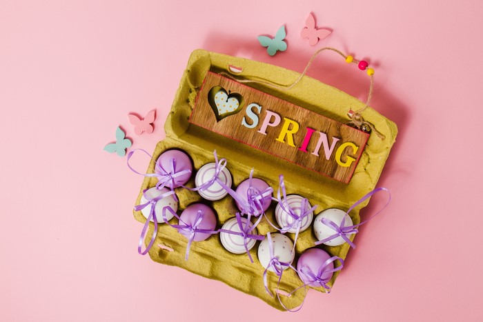 Easter eggs in a carton with a SPRING sign