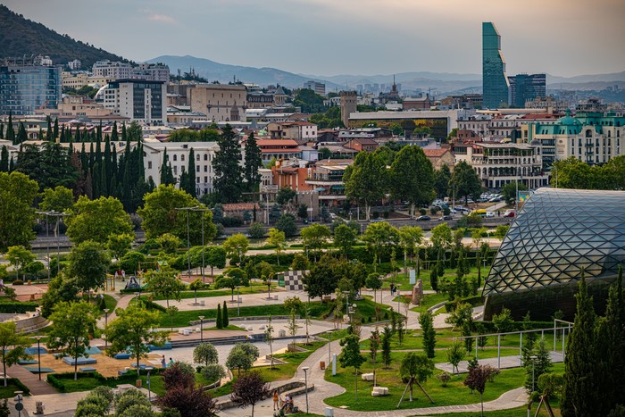 Tbilisi, Georgia cityscape with mountains and park