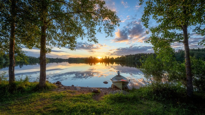 Boat on a lake at sunset in Finland