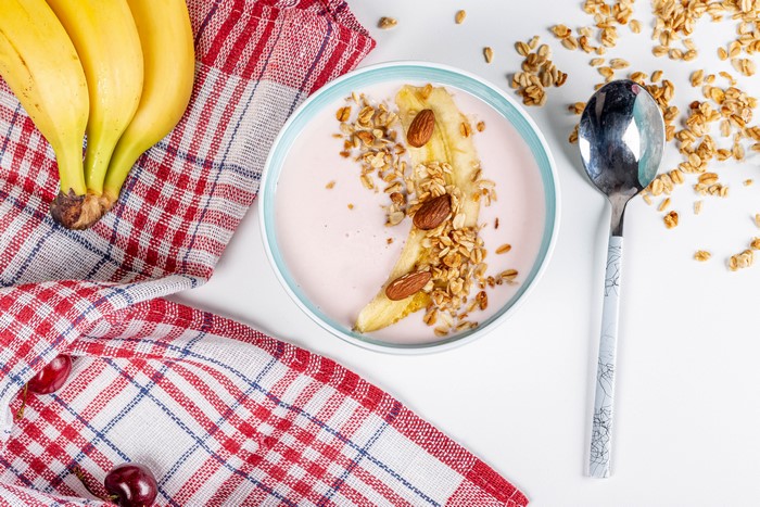 Yogurt bowl with banana, granola, and almonds