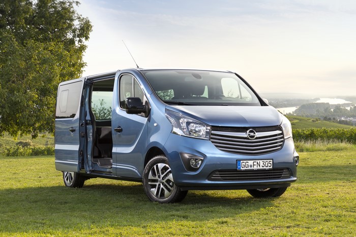 Light Blue Opel Vivaro Minivan on Grass