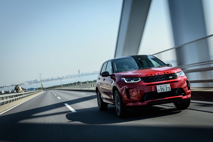 Red Land Rover Discovery Sport on a Bridge