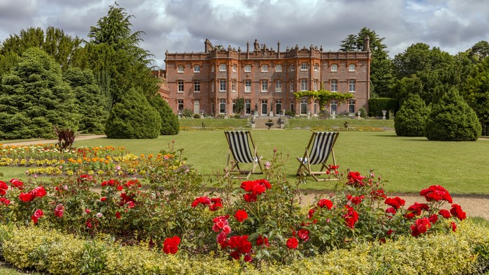 Hughenden Manor Park with roses and deck chairs