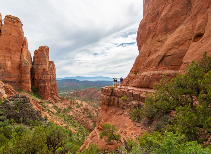 People on cliff edge in Sedona, Arizona