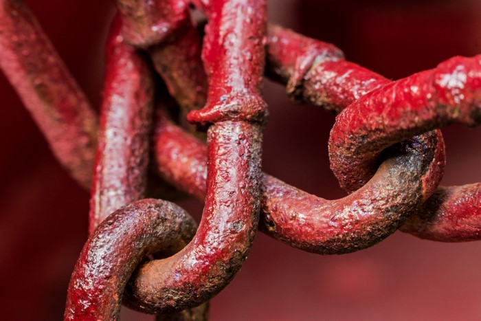 Close-up of a rusty red chain