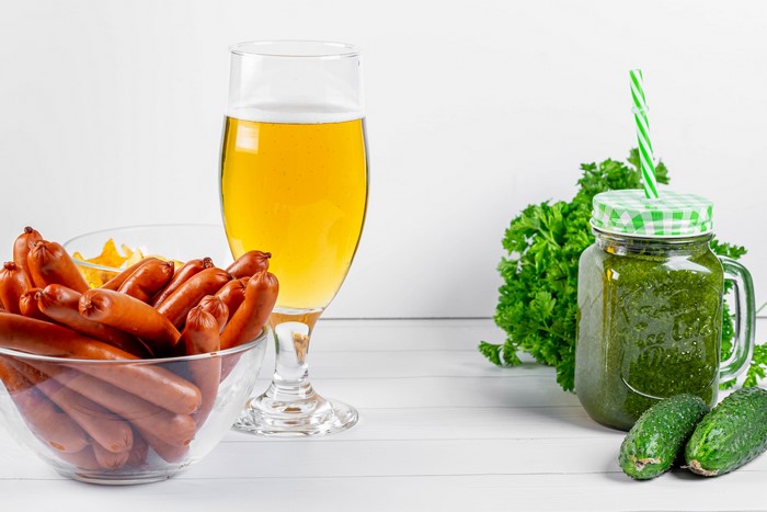 Beer, sausages, smoothie, cucumbers, and parsley