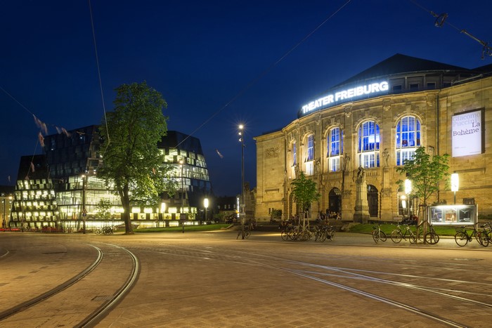 Theater Freiburg and modern building at night
