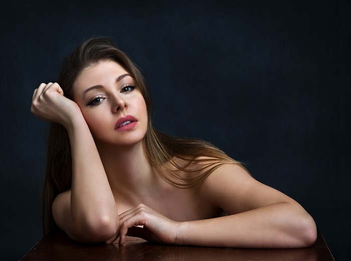 Woman resting her head on her hand