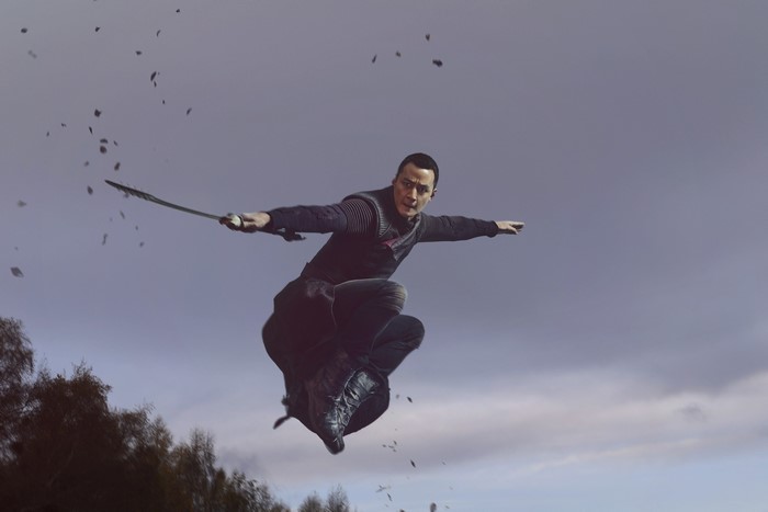 Daniel Wu from Into the Badlands jumping with a sword