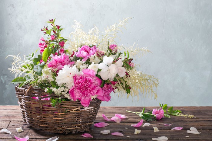 Peonies in a Wicker Basket on a Table