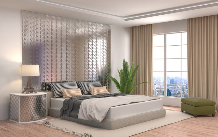 Modern Bedroom Interior with Bed, Pillows, and Lamp