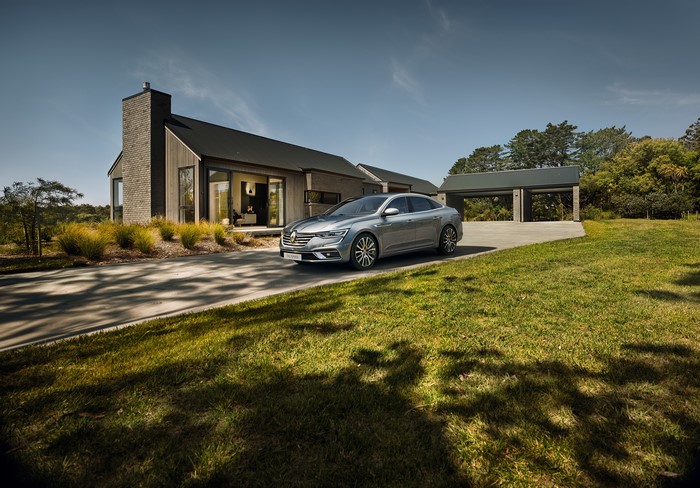 Renault Talisman Estate car in front of a modern house