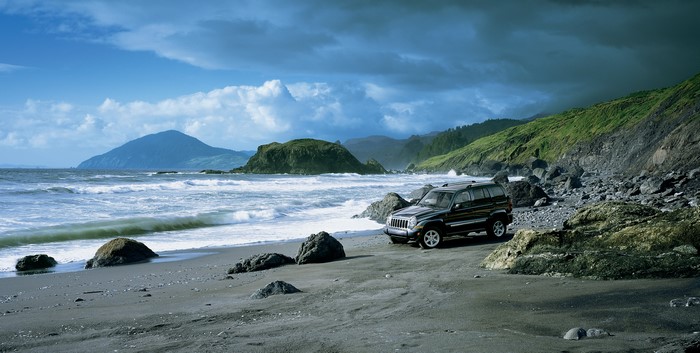 Black Jeep Liberty Limited on a rocky coast