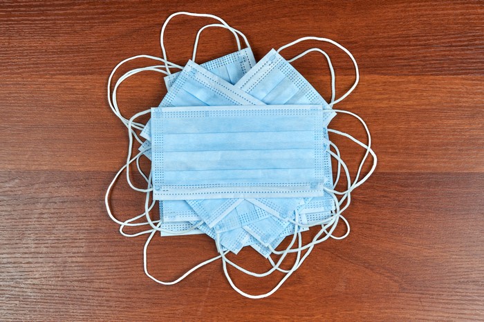 Pile of Light Blue Disposable Masks