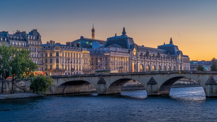 Pont du Carrousel bridge over the Seine River in Paris at sunset
