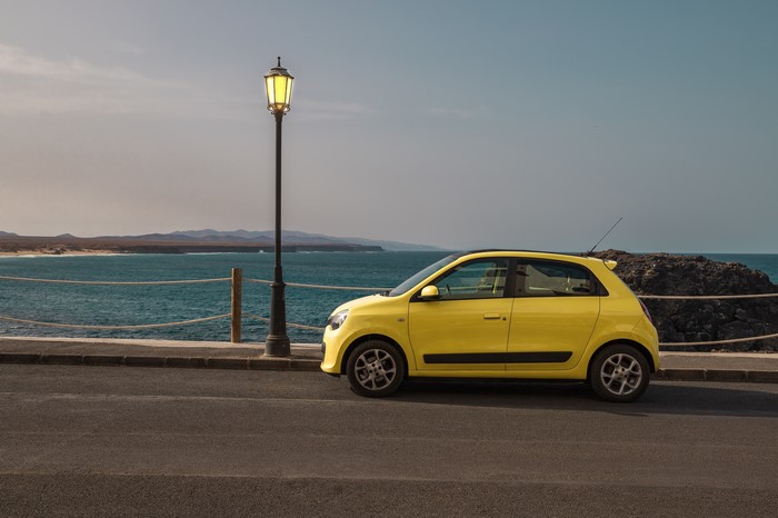 Yellow Renault Twingo parked by the sea