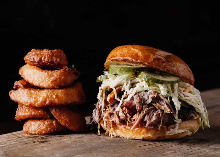 Pulled pork sandwich with onion rings