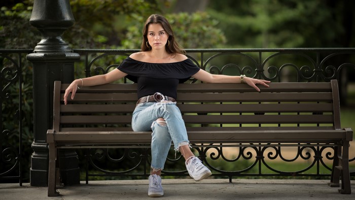 Woman Sitting on a Park Bench