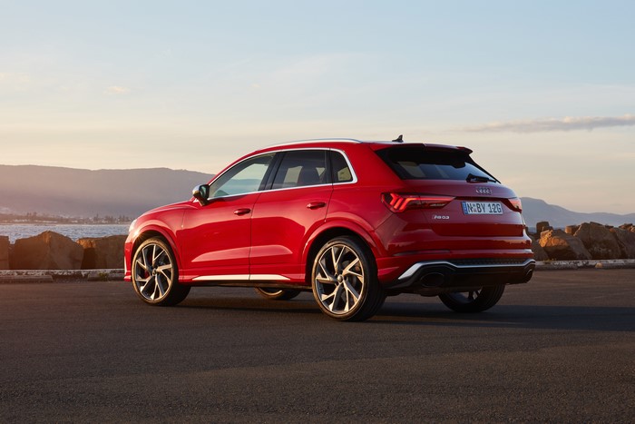 Red Audi RS Q3 Crossover parked by the sea
