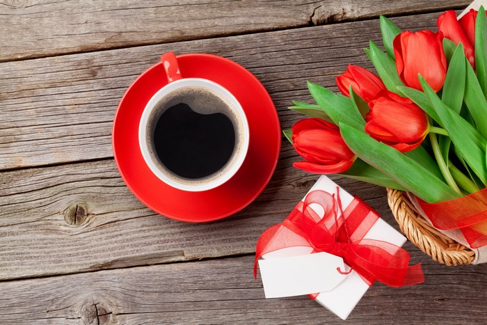 Red Tulips, Coffee Cup, and Gift Box on Wood