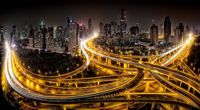 Nighttime cityscape of Shanghai with illuminated highways
