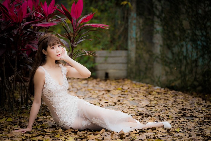 4K Asian Woman Sitting in White Dress
