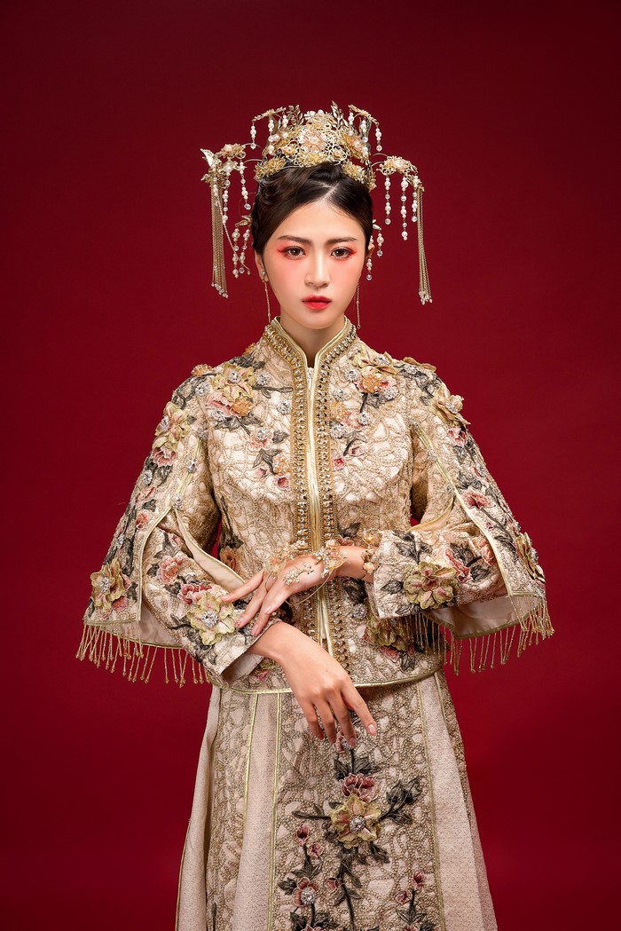 Woman in traditional Chinese wedding dress with elaborate headpiece