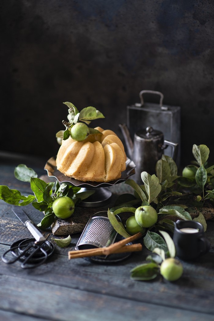 Bundt cake with apples and baking tools