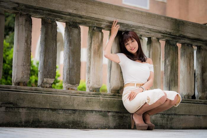 4K Asian Woman Smiling in White Outfit
