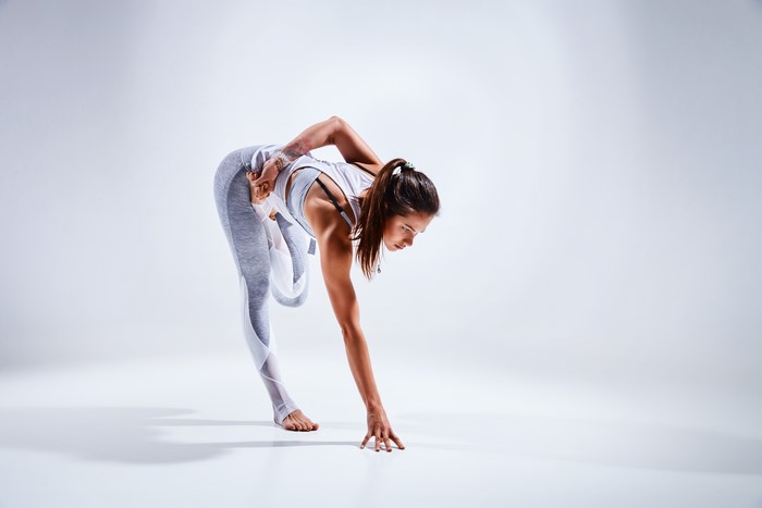 Woman performing a yoga stretch exercise