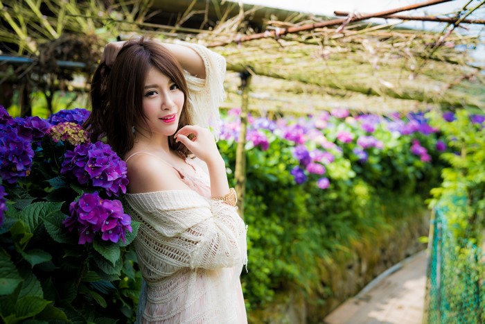 4K Asian Woman Posing with Purple Flowers