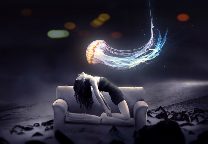 Woman posing on a sofa with a jellyfish
