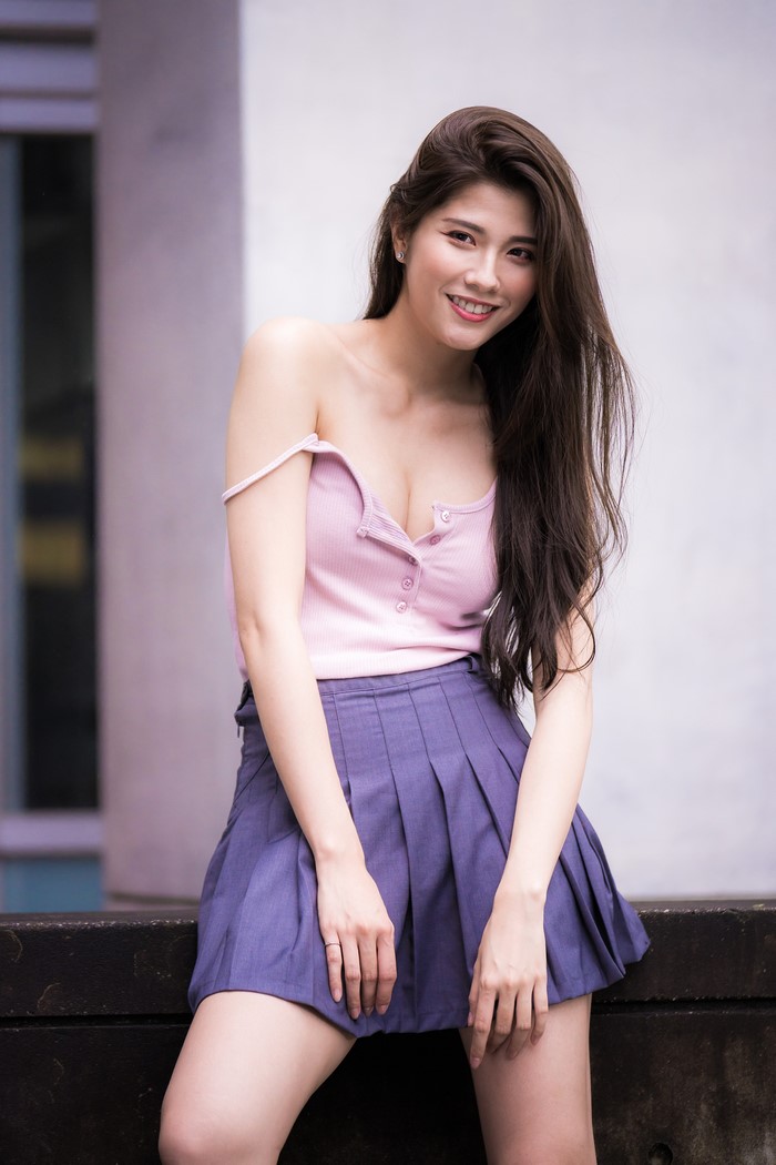 Asian Woman Smiling with Purple Skirt