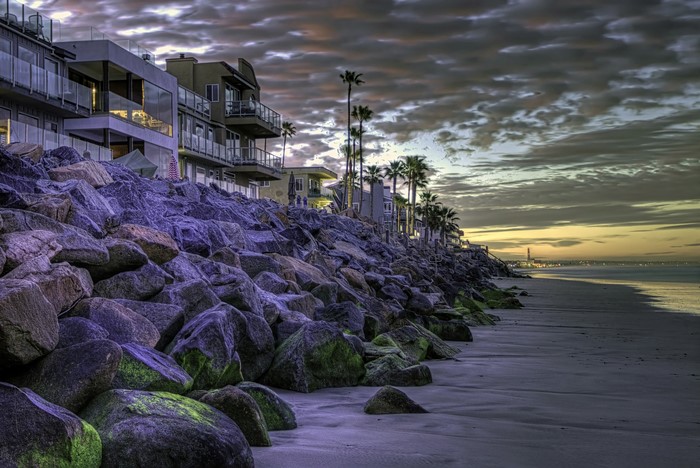 Houses on a rocky coast at sunset in Oceanside, California