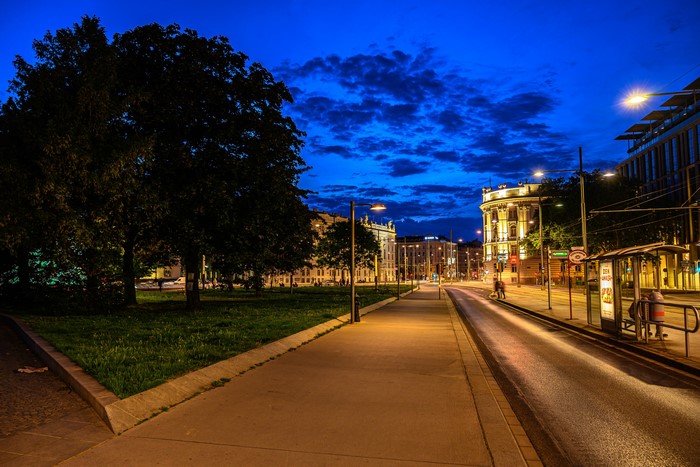 Street scene in Vienna at night with tram tracks