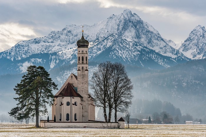 St. Coloman Church in Bavaria with Snowy Alps