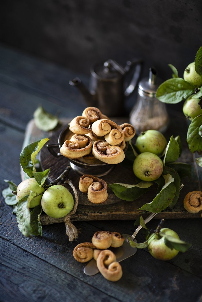 Cinnamon Swirl Pastries with Apples on Wooden Table
