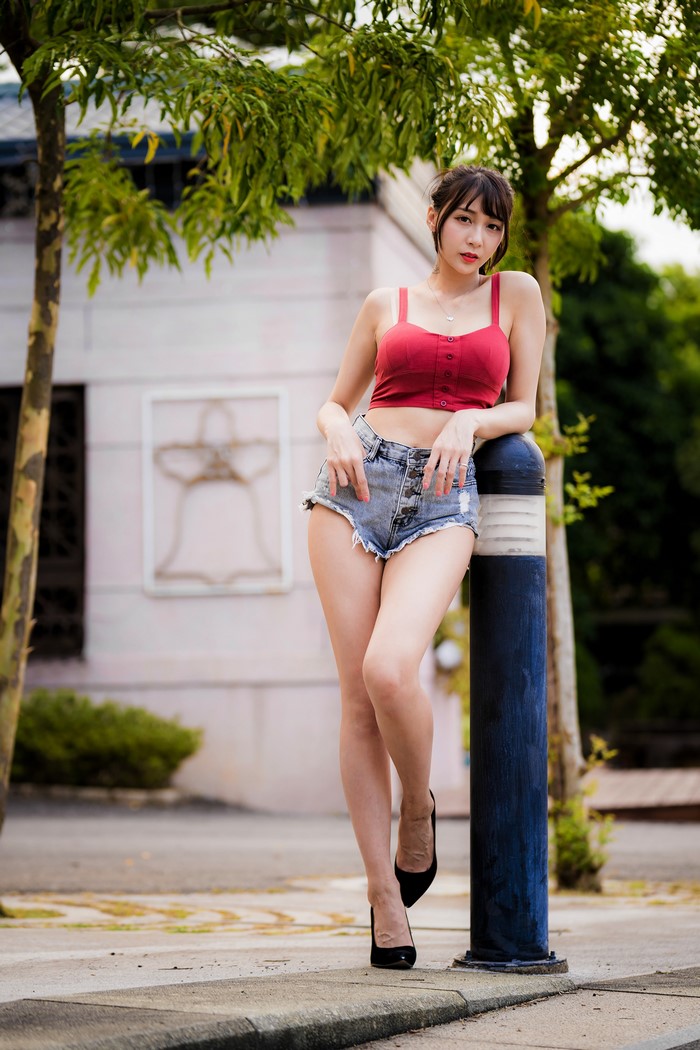 Asian Woman Posing in Red Singlet and Shorts
