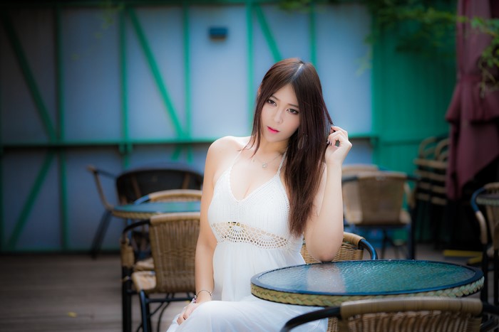 4K Asian Woman in White Dress Sitting