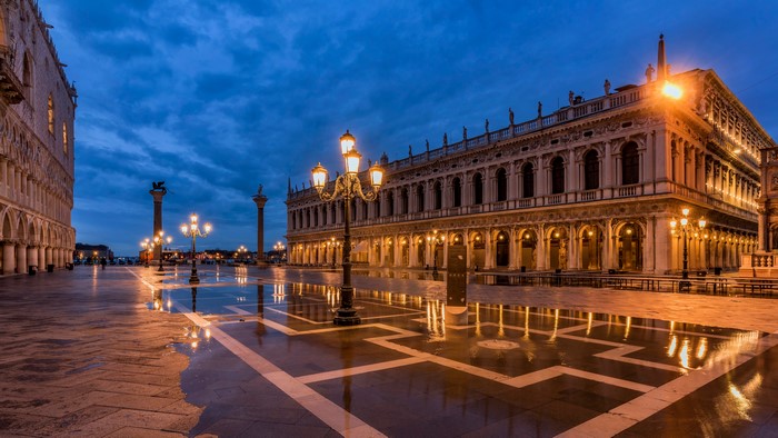 Venice town square with street lights at dusk