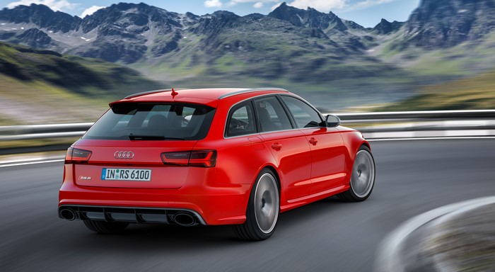 Red Audi RS6 Avant performance car on a mountain road