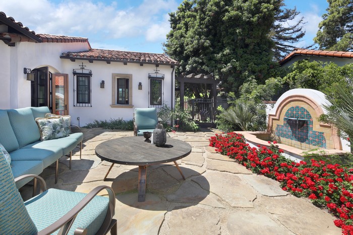 Outdoor patio with fountain and seating