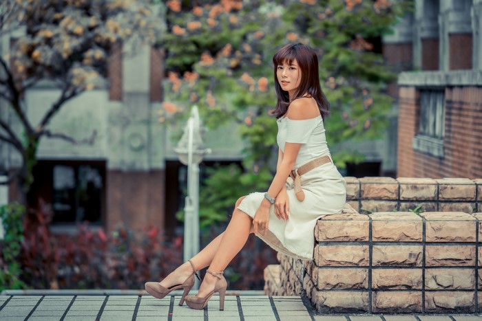 4K Sitting Asian Woman in Dress and Stilettos