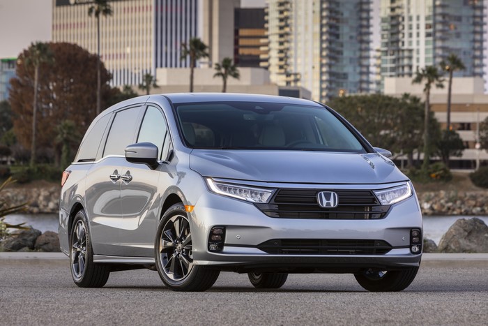 Silver Honda Odyssey Minivan parked near buildings