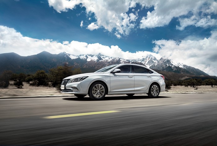 White Changan Sedan on a Mountain Road