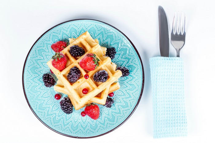 Waffles with Strawberries, Blackberries, and Currants on a Plate