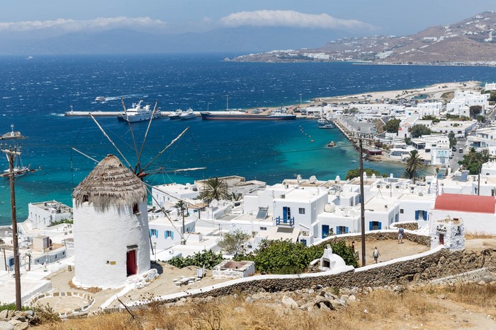 Windmill and harbor in Mykonos, Greece
